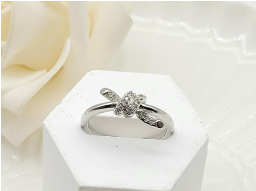 Silver-Plated Crystal Knot Ring – Adjustable Love Knot Statement Band
