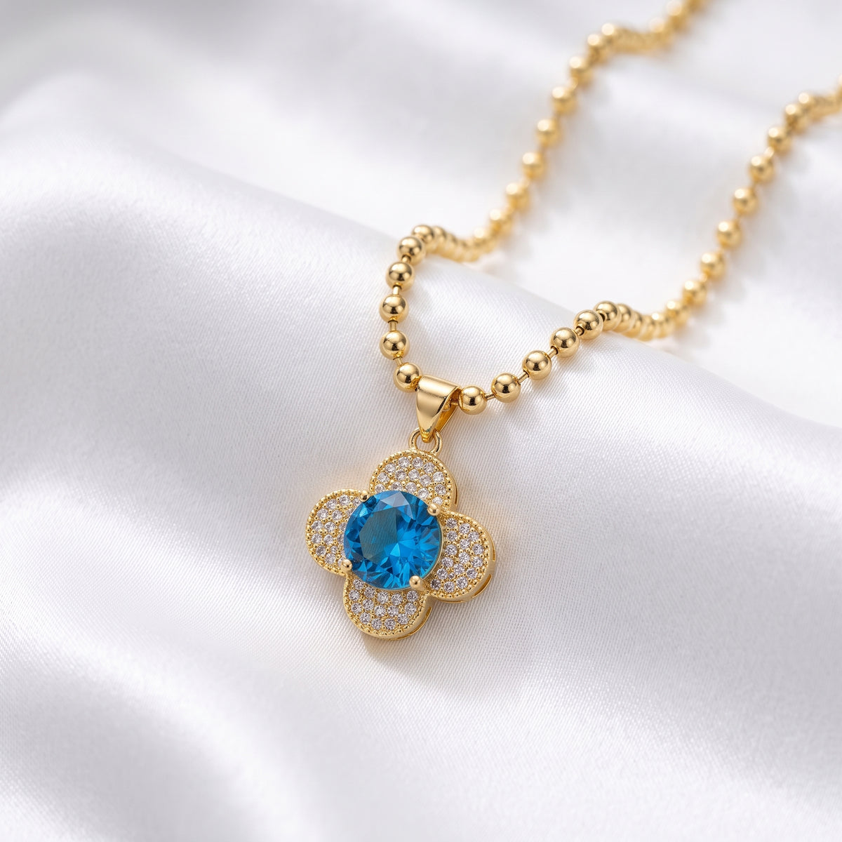 Blue Crystal Four-Leaf Clover Ball Chain Necklace – 18K Gold Plated Gemstone