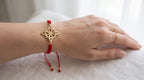 Gold-Plated Red Cord Celtic Knot Bracelet – Adjustable Woven Charm Bangle